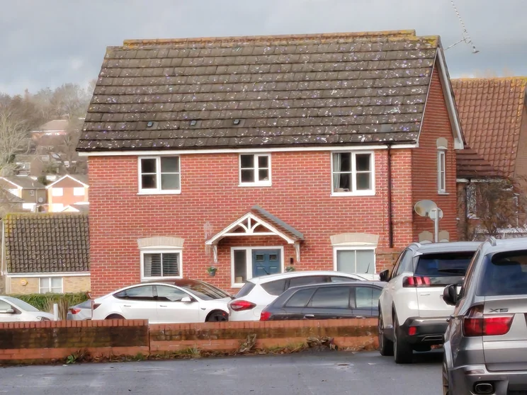 10x digital zoom of a red house