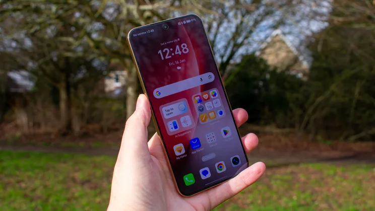 Honor Magic 8 Lite in hand, front view with the display on