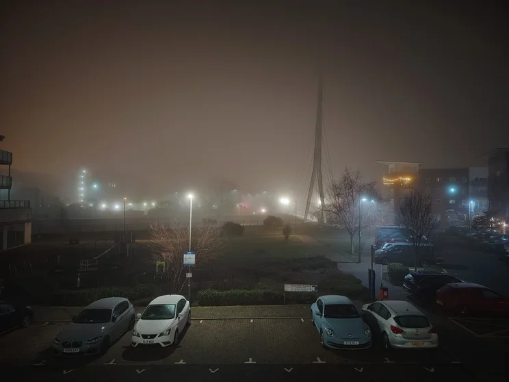 A car park on a foggy night