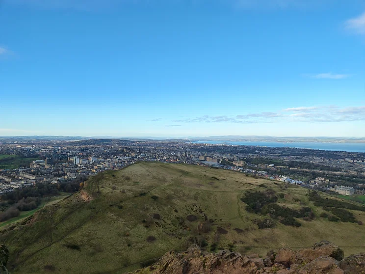 Sweeping hills, city in the distance