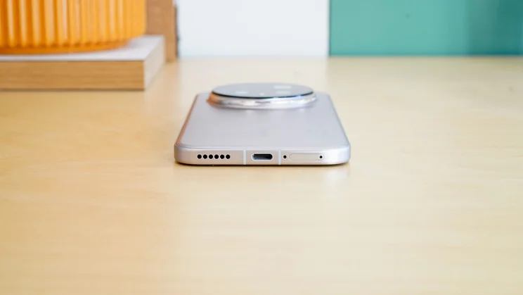 Honor Magic 8 Pro face down on a table, bottom view