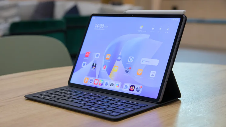 Huawei MatePad 11.5 S (2026) in keyboard case, from the front right quarter, on a wood table