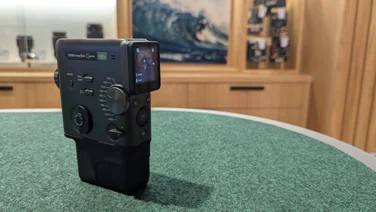 The Instax Mini Evo Cinema camera on a felt table in Fujifilm's House of Photography store