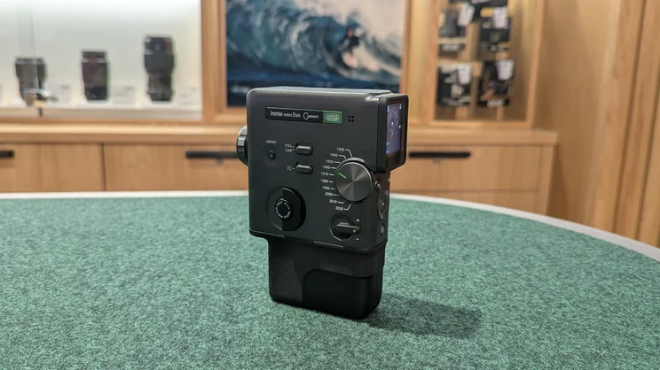 The Instax Mini Evo Cinema camera on a felt table in Fujifilm's House of Photography store