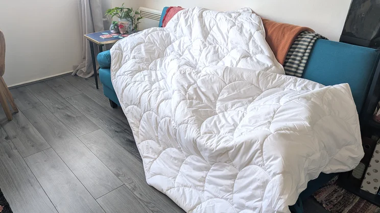 The Larke Nature's Blend duvet draped over a sofa