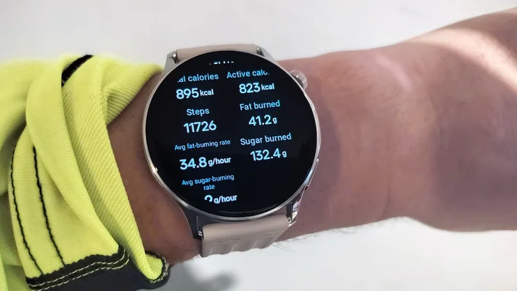 OnePlus Watch Lite on wrist, showing workout stats