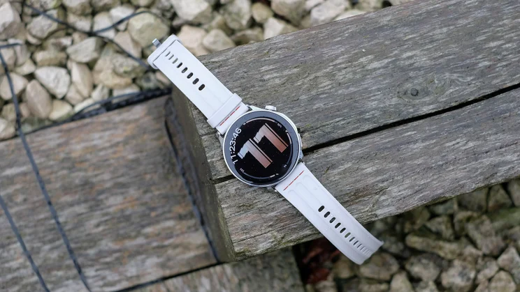 OnePlus Watch Lite on a wooden beam, face up