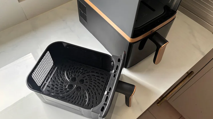 The Philips 4000 Series Stacked Dual Basket Air Fryer on a kitchen worktop, with its upper drawer removed, viewed from above