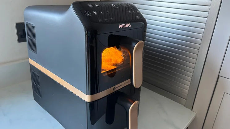 Chips cooking in the top drawer of the Philips 4000 Series Stacked Dual Basket Air Fryer