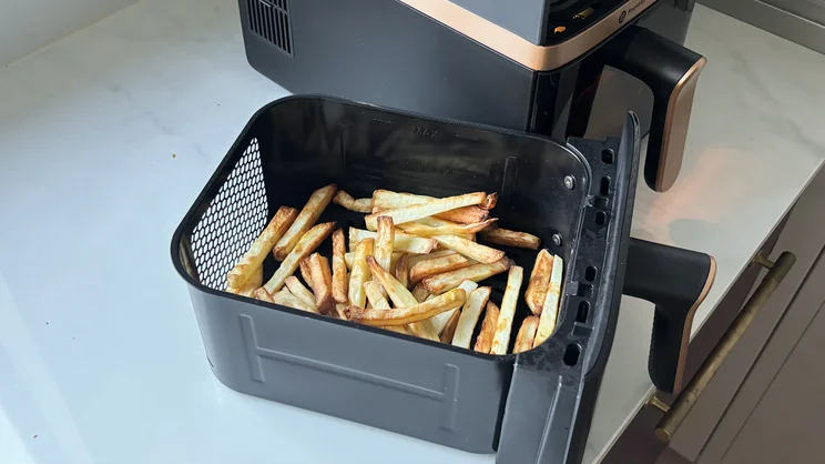 Cooked chips in a draw of the Philips 4000 Series Stacked Dual Basket Air Fryer