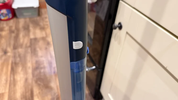 A closeup of the Philips OneUp mop's charging port