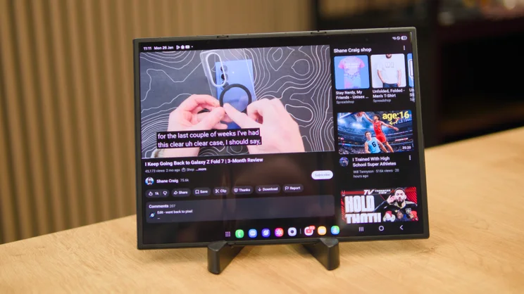 The Samsung Galaxy Z TriFold, unfolded, pictured showing YouTube stretched across the full width of the 10in internal screen