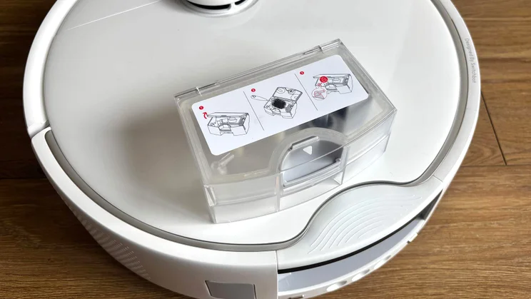 The Switchbot S20 robot vacuum's dust collector, placed on top of the vacuum