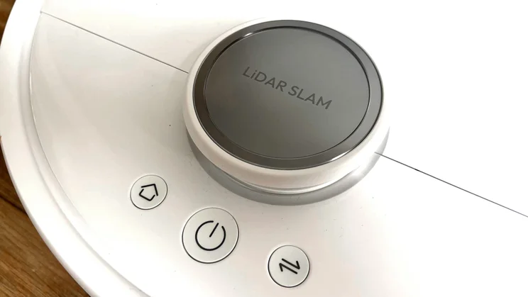 A closeup of the top of the Switchbot S20 robot vacuum, showing LiDAR and buttons
