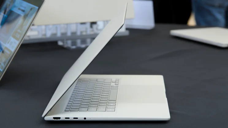 The Asus Zenbook A16 (2026), half open, pictured from the left edge