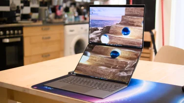 The Asus Zenbook Duo 2026, open fully on a kitchen table