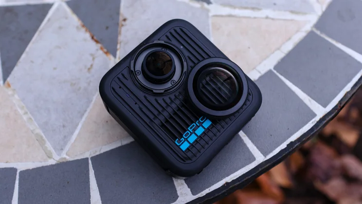 The GoPro Max 2 pictured withe one of its screw on lens cap protectors removed