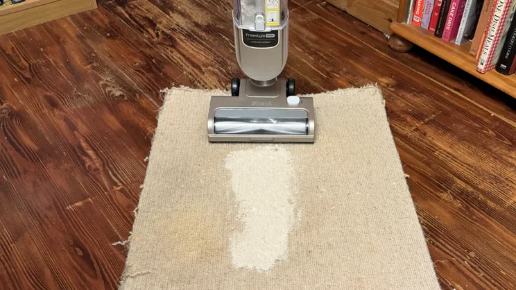 The Shark Freestyle Pro about to carry out the flour on carpet test