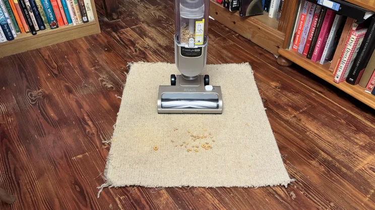 The Shark Freestyle Pro after testing with Cheerios on carpet