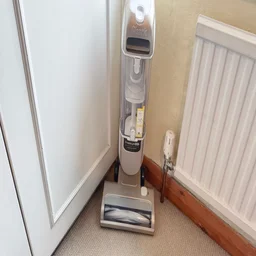 The Shark Freestyle Pro pictured in a corner, from the front