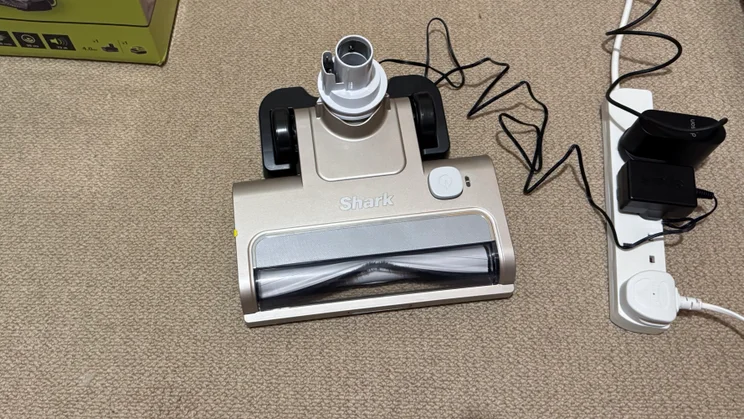 The Shark Freestyle Pro's motor head being charged