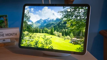 Front view of the Amazon Echo Show 11 displaying an image of a mountain scene in Slovenia