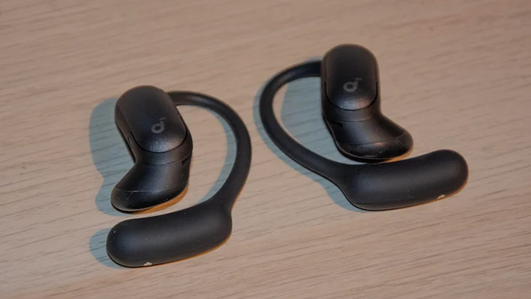 The Anker Soundcore AeroFit 2 Pro earbuds with their earhooks facing downwards