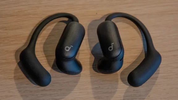 The Anker Soundcore AeroFit 2 Pro on a wooden table