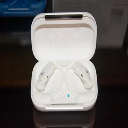 The Anker Soundcore AeroFit 2 Pro in their charging case