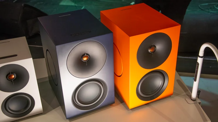 Front view of the Cambridge Audio L/R X active speakers in orange and blue