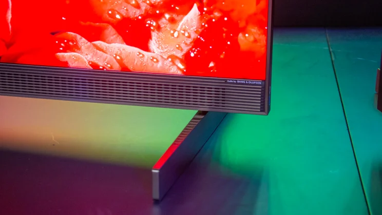 Close-up of the Sound by Bang & Olufsen logo on the speaker running along the bottom of the TCL X11L SQD Mini LED TV