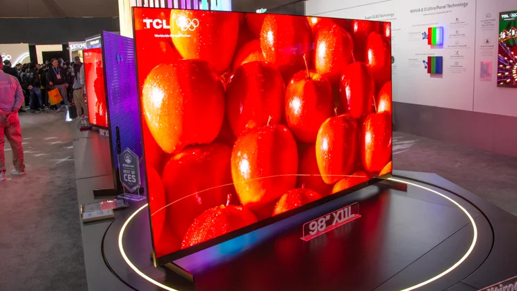 Left view of the 98in TCL X11L SQD Mini LED TV on the show floor at CES