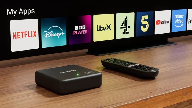 The Manhattan Aero 4K TV Streamer with Freely in front of a TV