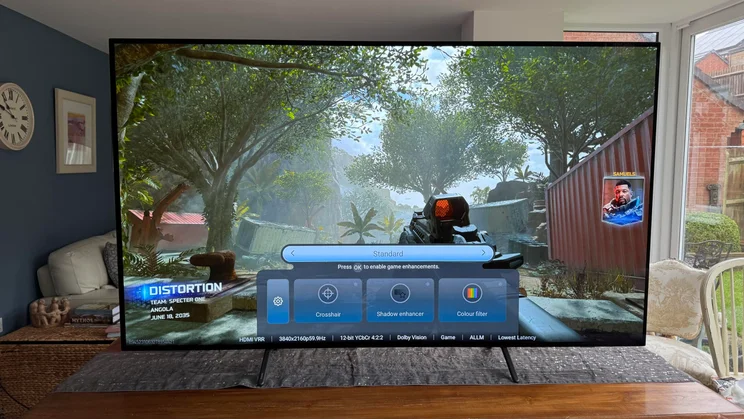 Front view of the Philips OLED810 TV with the Game Bar menu displayed on screen