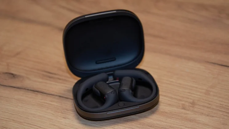 The Shokz OpenFit Pro charging case open with the earbuds inside