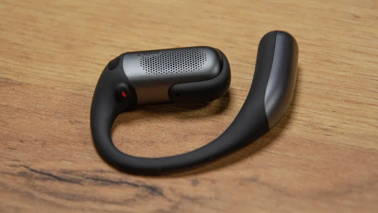 The control button on one of the earbuds of the Shokz OpenFit Pro