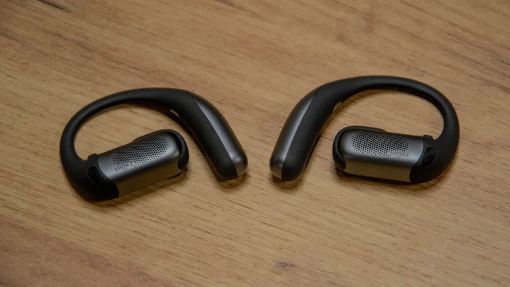 Featured image of the Shokz OpenFit Pro headphones on a wooden table