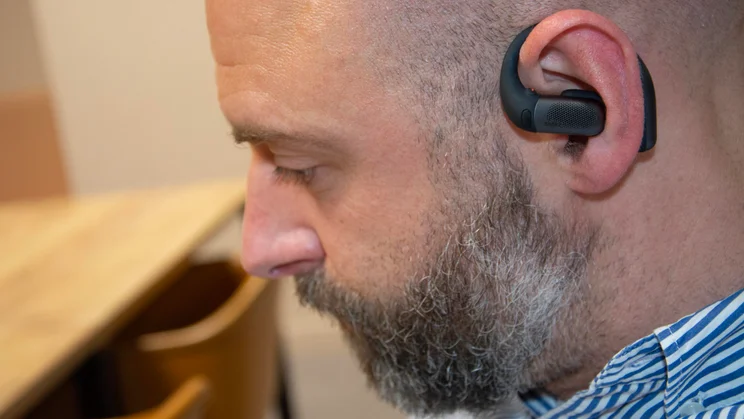 Side view of the Shokz OpenFit Pro being worn