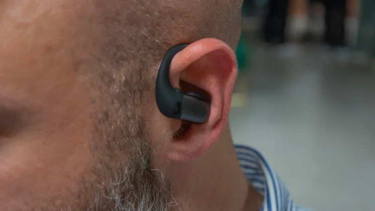 Front view of the left earpiece of the Shokz OpenFit Pro being worn
