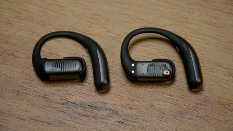 The Shokz OpenFit Pro with one earpiece facing up and one facing downwards