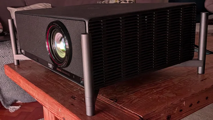 Close-up of the XGIMI Titan projector on a wooden table