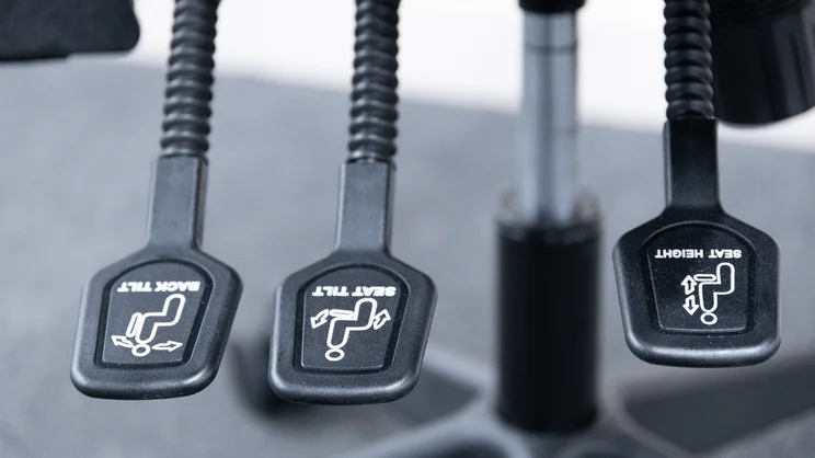 A closeup of the Posturite Homeworker Plus office chair's adjustment levers