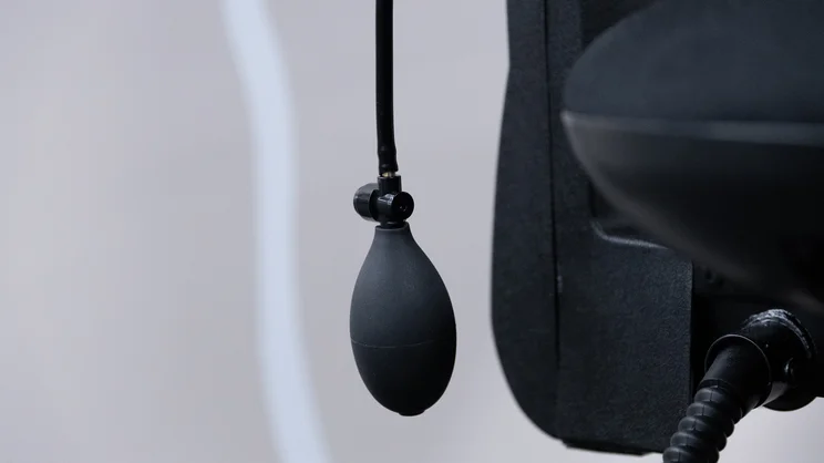 A closeup of the Posturite Homeworker Plus office chair's lumbar pump