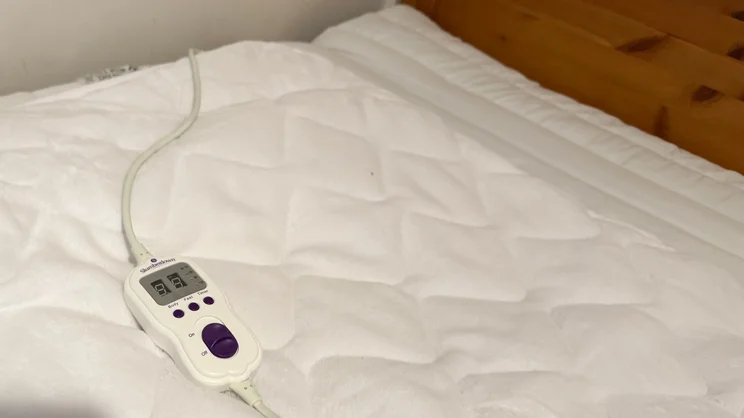 A closeup of the top section of the Slumberdown Wonderfully Warm Electric Blanket, with the controls on top