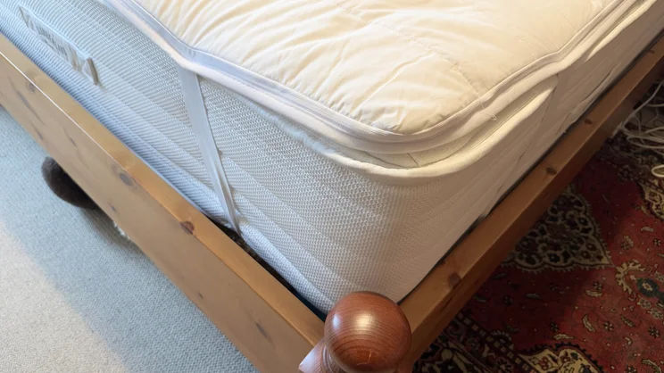 A closeup of the corner of the Snuggledown Intelligent Warmth electric blanket, on a mattress