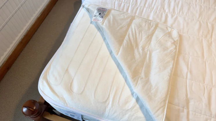 A closeup of a corner of the Snuggledown Intelligent Warmth electric blanket, the cover has been moved away to show the heating elements