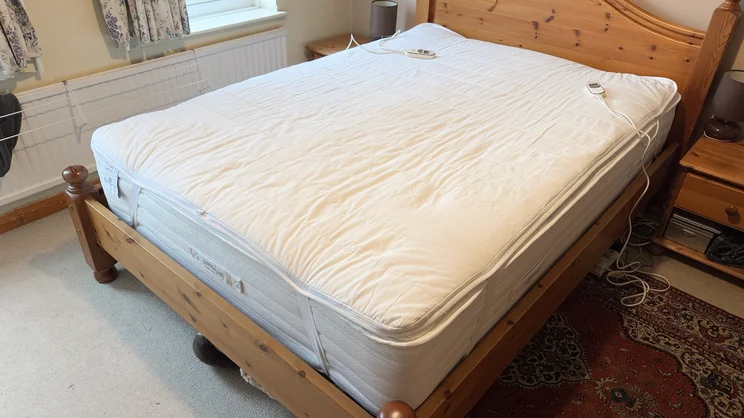 The Snuggledown Intelligent Warmth electric blanket on a mattress