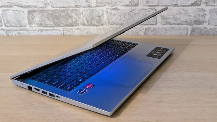 The Acer Aspire Go 15 (AG15-42P) half closed, pictured from the front left quarter