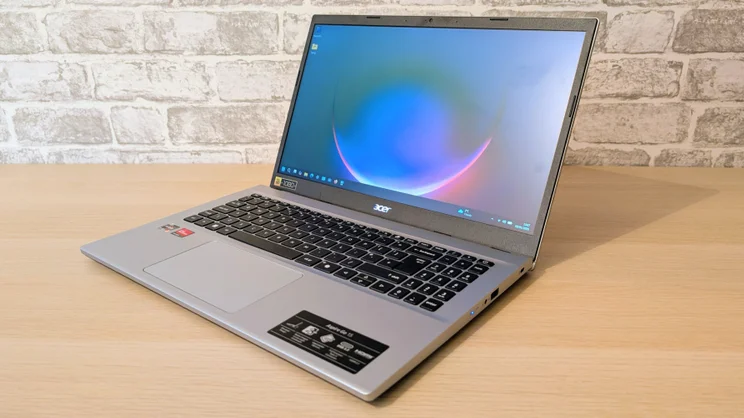 The Acer Aspire Go 15 (AG15-42P), open, pictured from the front right quarter