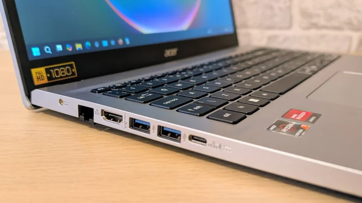 The Acer Aspire Go 15 (AG15-42P), open, pictured from the left edge, close up